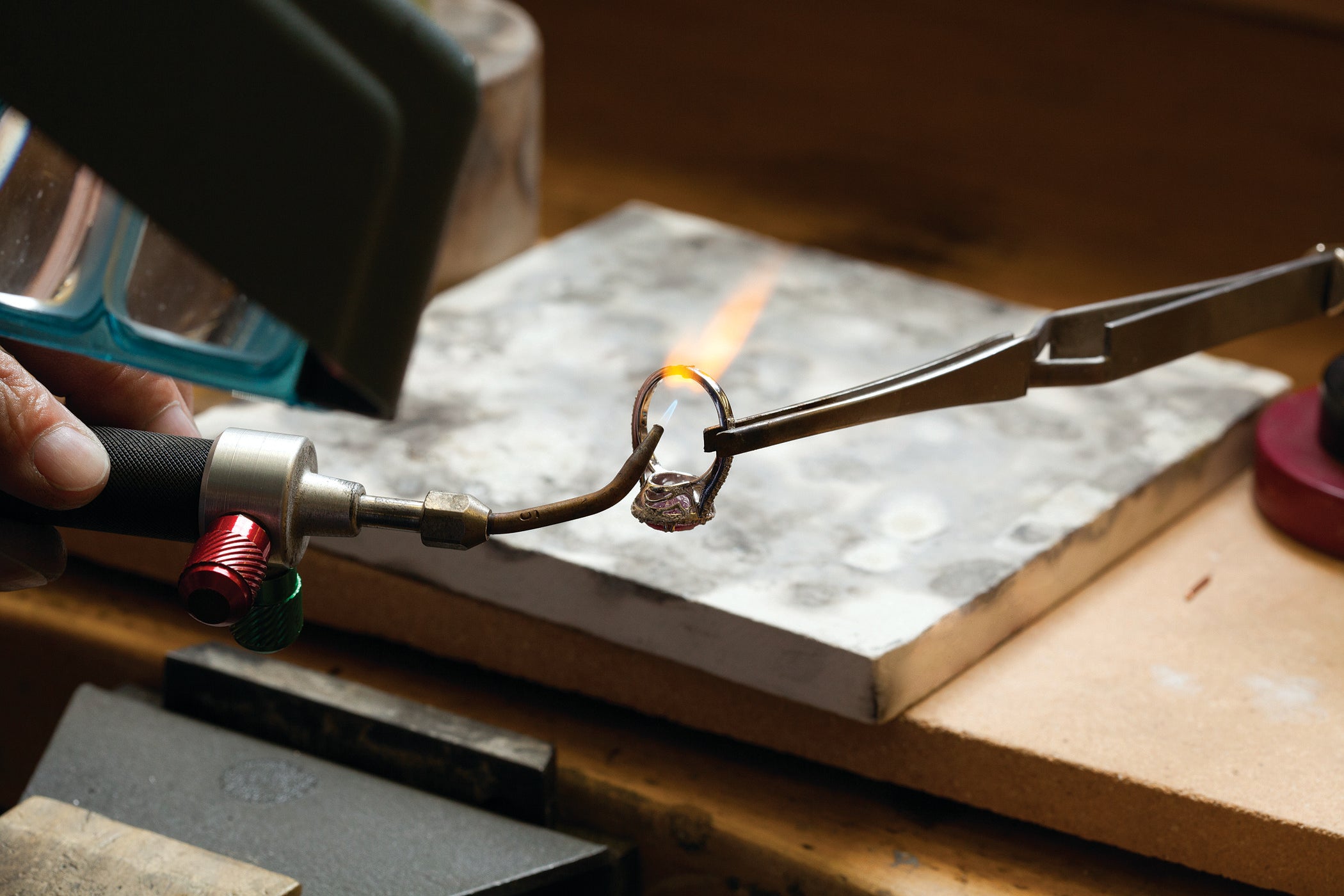 Jeweler making custom ring