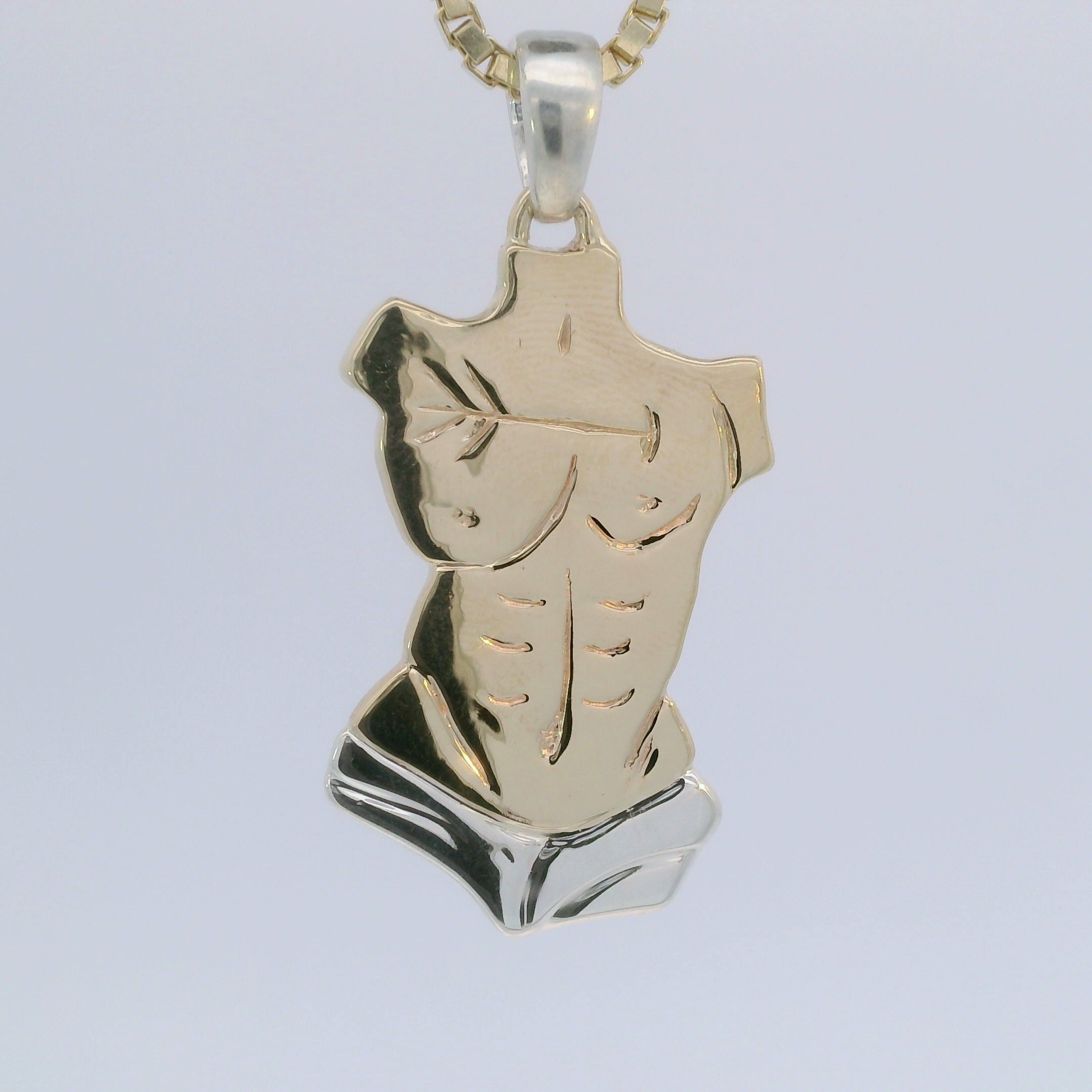 Hand carved and custom cast pendant