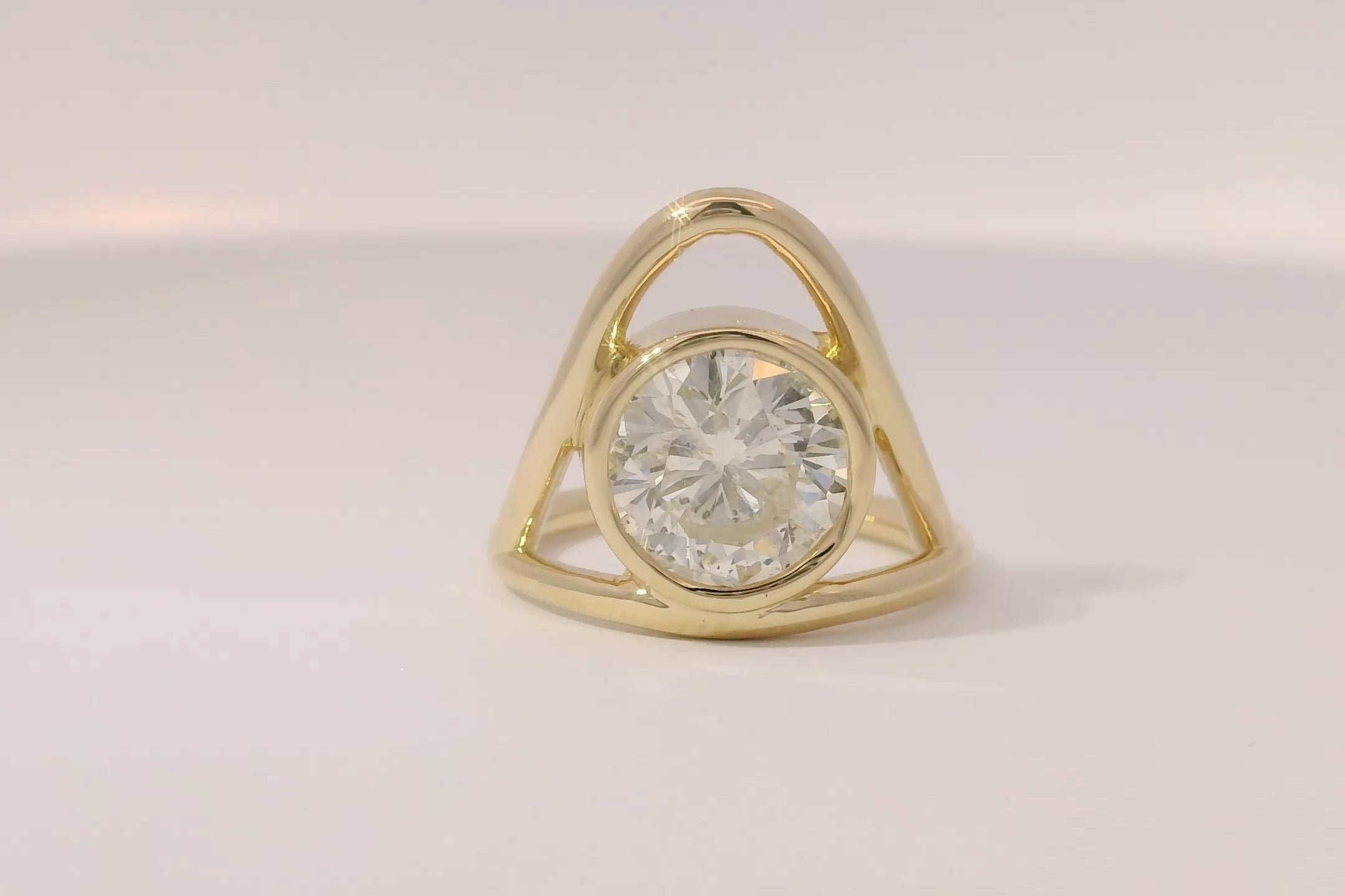 Custom round diamond bezel engagement ring