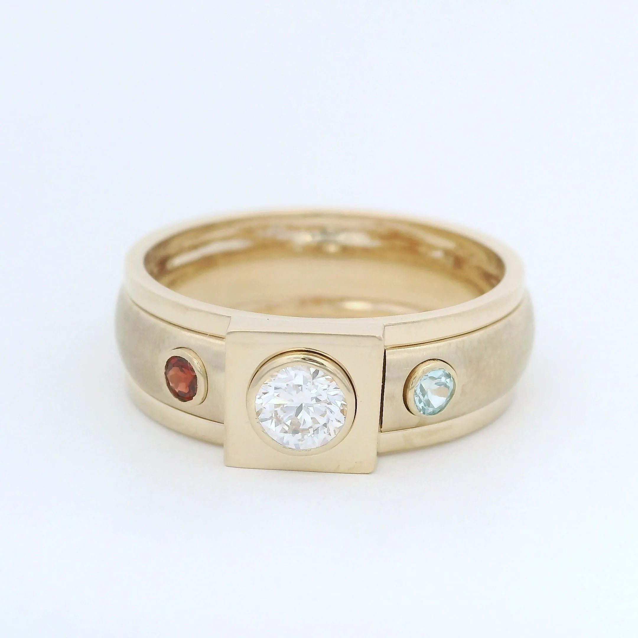 Custom gold ring with gemstones and diamond