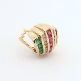 Gold slide pendant with green and red gemstones on a white background