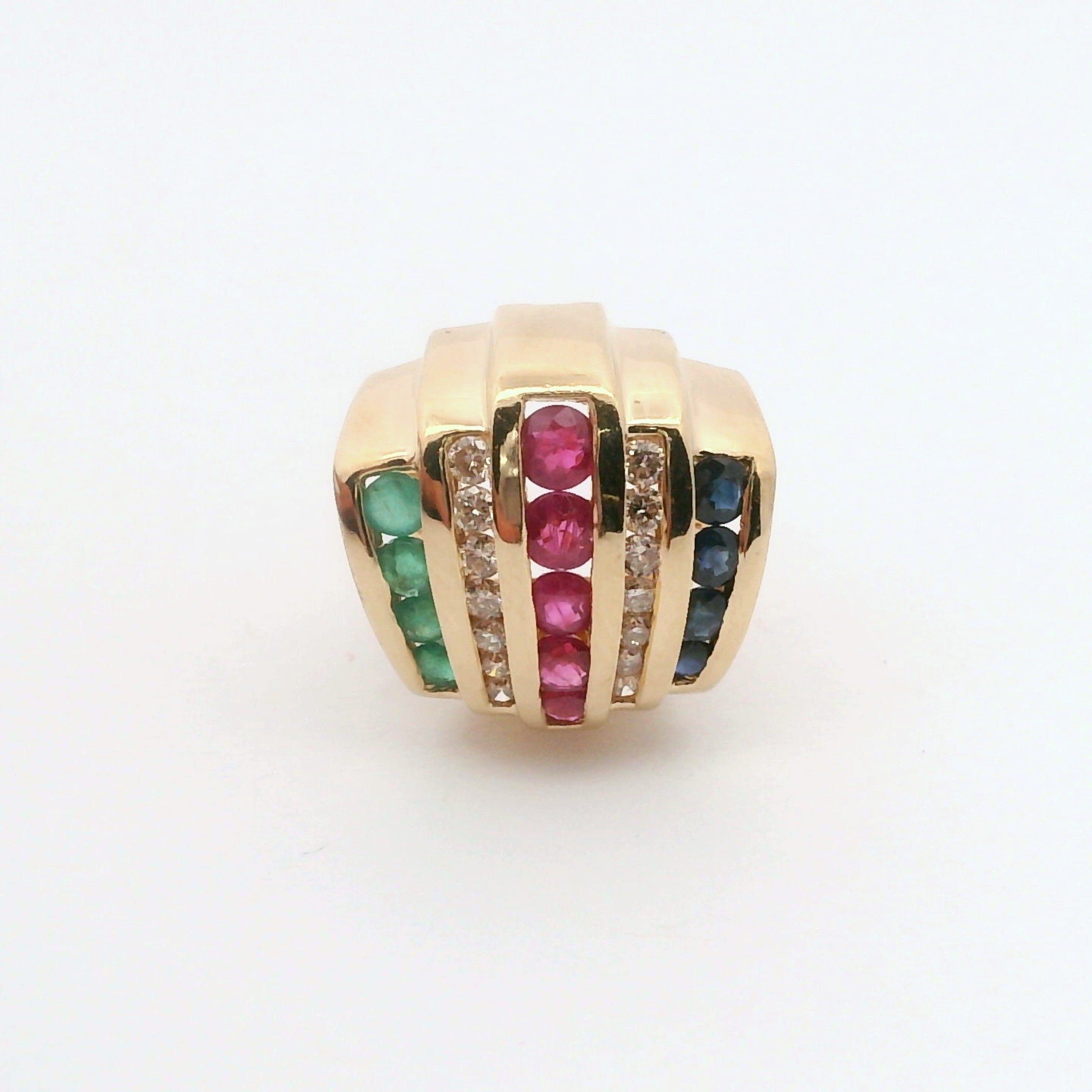 Gold pendant with colorful gemstones on a white background
